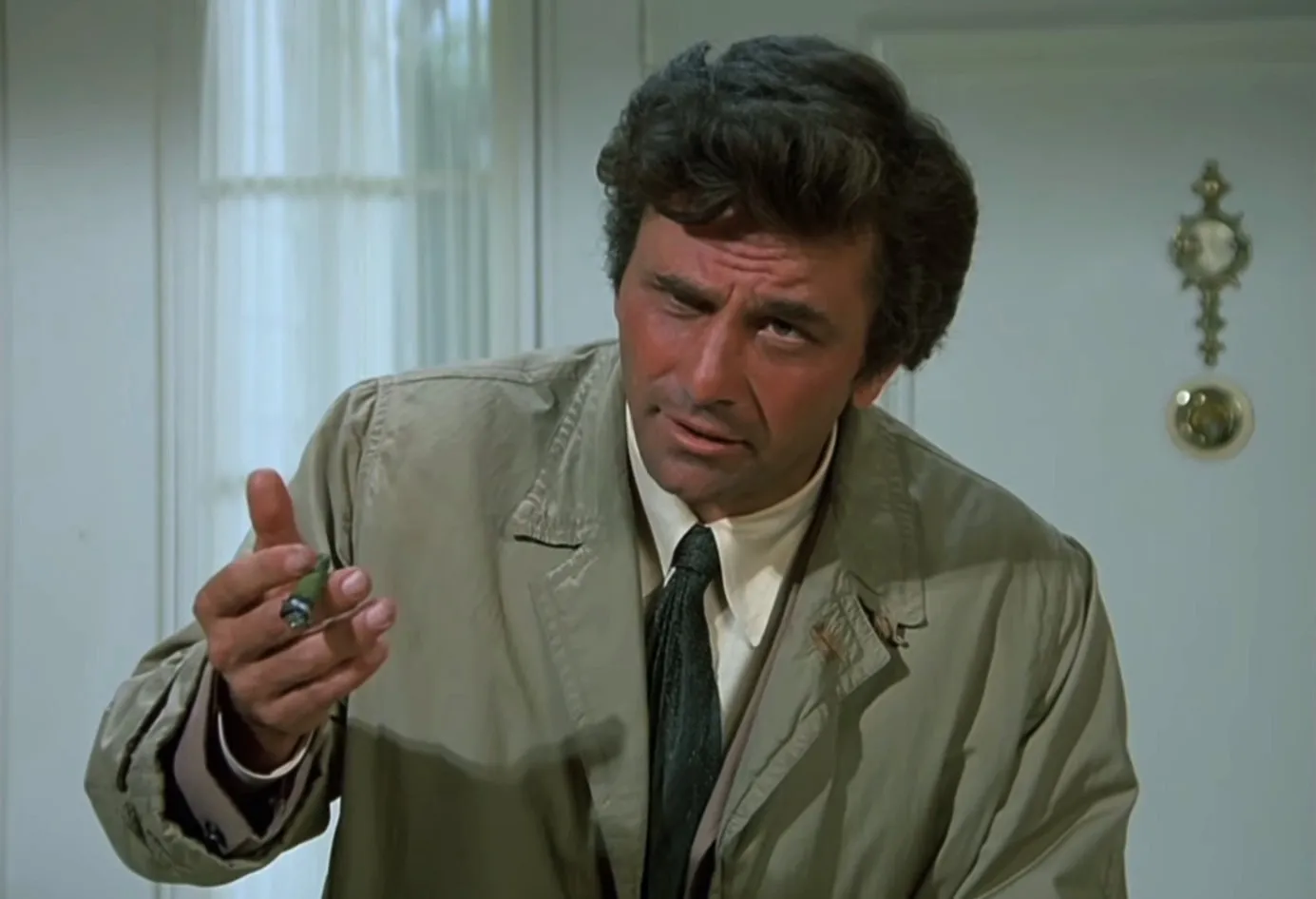 Freeze frame of Lieutenant Detective Columbo looking disheveled, about
to wreck your whole dastardly plan